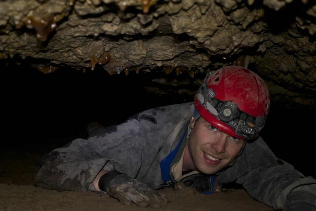 Figure 2: Tom de Haas in Red October Cave. Photo Credit: Claire Gougeon
